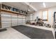 Spacious garage with ample storage and overhead shelving at 130 Willow Bend Dr, Youngsville, NC 27596