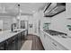 Open concept kitchen features stainless steel appliances, quartz countertops and a gas cooktop at 130 Willow Bend Dr, Youngsville, NC 27596