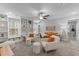 Bright living room featuring built-in shelving, cozy seating, and natural light, perfect for relaxing at 130 Willow Bend Dr, Youngsville, NC 27596