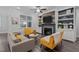 Living room with a fireplace, built-in shelving, and stylish gray and yellow furnishings at 130 Willow Bend Dr, Youngsville, NC 27596