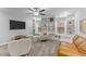 Stylish living room with custom built-ins, plush seating, and ample natural light at 130 Willow Bend Dr, Youngsville, NC 27596