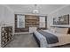 Comfortable main bedroom with accent wall, chandelier, and natural light at 130 Willow Bend Dr, Youngsville, NC 27596