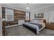 Comfortable main bedroom with accent wall, chandelier, and natural light at 130 Willow Bend Dr, Youngsville, NC 27596
