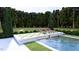 Inviting pool area with lounge chairs, mature landscaping, and a serene atmosphere at 1612 Hunting Ridge Rd, Raleigh, NC 27615