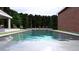 Expansive pool area offering a tranquil setting with lush landscaping at 1612 Hunting Ridge Rd, Raleigh, NC 27615