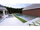A luxurious pool and spa area complemented by an adjacent outdoor lounge at 1612 Hunting Ridge Rd, Raleigh, NC 27615
