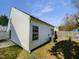 Exterior side view of home, showing siding, windows and backyard access at 1628 Beacon Village Dr, Raleigh, NC 27604