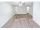 Spacious bedroom featuring neutral carpet, a ceiling fan, and access to the ensuite bathroom at 1628 Beacon Village Dr, Raleigh, NC 27604