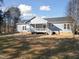 The back of this house has siding and a porch at 1915 Lambert Rd, Graham, NC 27253