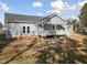 Exterior view of the back of the house with siding and a back porch at 1915 Lambert Rd, Graham, NC 27253