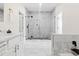 Modern bathroom showcasing a glass enclosed shower with marble tiling at 1915 Lambert Rd, Graham, NC 27253