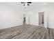 Spacious bedroom featuring sleek ceiling fan, and gray-toned flooring at 1915 Lambert Rd, Graham, NC 27253