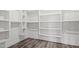 Walk-in closet with modern grey flooring and built-in storage shelves at 1915 Lambert Rd, Graham, NC 27253