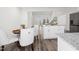 Open concept kitchen and dining area with modern finishes and stainless steel appliances at 1915 Lambert Rd, Graham, NC 27253