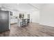 Bright eat-in kitchen features white cabinetry, granite countertops, stainless appliances, and vinyl floors at 1915 Lambert Rd, Graham, NC 27253