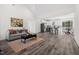 Open floor plan features living room, kitchen, and dining area with modern finishes and lots of natural light at 1915 Lambert Rd, Graham, NC 27253