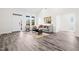 Bright living room boasts vaulted ceilings, vinyl floors, modern decor, and natural light from large windows at 1915 Lambert Rd, Graham, NC 27253