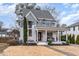 Beautiful two-story home with a welcoming front porch, complemented by lush landscaping at 2005 Bernard St, Raleigh, NC 27608