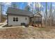 Home backyard featuring a screened porch with a classic outdoor grill at 2482 Golden Forest Dr, Franklinton, NC 27525