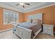 Bright bedroom with a large window and tray ceiling at 2482 Golden Forest Dr, Franklinton, NC 27525