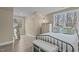 Nicely staged bedroom with wood-look flooring, ample natural light, and calming decor at 2482 Golden Forest Dr, Franklinton, NC 27525