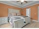 Bright bedroom with a large window and tray ceiling at 2482 Golden Forest Dr, Franklinton, NC 27525