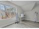 Bright bonus room features a large window offering scenic views and light gray wood-look flooring at 2482 Golden Forest Dr, Franklinton, NC 27525