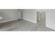 View of bonus room showcasing light gray wood-look floors, perfect for a variety of uses at 2482 Golden Forest Dr, Franklinton, NC 27525