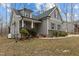 Attractive gray two-story house showcasing a classic design and manicured front yard at 2482 Golden Forest Dr, Franklinton, NC 27525
