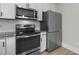 Well-lit kitchen featuring stainless steel appliances and white cabinetry at 2482 Golden Forest Dr, Franklinton, NC 27525