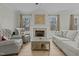 Cozy living room featuring a fireplace with tile surround and neutral toned furniture at 2482 Golden Forest Dr, Franklinton, NC 27525