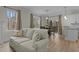 Living room open to the dining area with large windows that offer great natural light at 2482 Golden Forest Dr, Franklinton, NC 27525