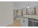 Open concept, showing the flow from the kitchen into the cozy and neutral toned living room at 2482 Golden Forest Dr, Franklinton, NC 27525