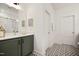 Stylish bathroom with modern vanity, lighting and black and white tile floors at 249 Beacon Dr, Pittsboro, NC 27312
