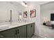Contemporary bathroom features a double vanity with quartz countertop, modern fixtures, and stylish patterned tile at 249 Beacon Dr, Pittsboro, NC 27312
