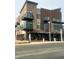 Modern mixed-use building featuring Hops & Berry, accented by brick, stone, and metal at 249 Beacon Dr, Pittsboro, NC 27312