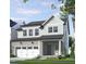 Charming two-story home with a brick facade, attached garage, and covered front porch at 249 Beacon Dr, Pittsboro, NC 27312