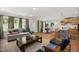 Open-concept living area with hardwood floors, neutral decor, and ample natural light at 249 Beacon Dr, Pittsboro, NC 27312