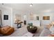 Bright living room boasts modern decor, comfortable seating and stylish accents for a cozy, inviting atmosphere at 249 Beacon Dr, Pittsboro, NC 27312