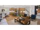 Spacious open-concept living area with hardwood floors, neutral decor, and abundant natural light at 249 Beacon Dr, Pittsboro, NC 27312