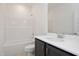 This bathroom features a shower-tub combination, gray vanity with white countertops, and a large mirror at 257 Beacon Dr, Pittsboro, NC 27312