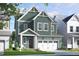 Charming two-story home with an attached two-car garage and well-maintained landscaping at 257 Beacon Dr, Pittsboro, NC 27312