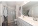 Clean bathroom features a dual sink vanity, enclosed shower, and modern accents at 306 Brier Summit Pl, Durham, NC 27703