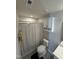 Standard bathroom features a toilet, combination shower and tub, and cabinet over the toilet at 306 Brier Summit Pl, Durham, NC 27703