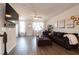 Spacious living room with comfortable seating, a ceiling fan, and a large TV for entertainment at 306 Brier Summit Pl, Durham, NC 27703