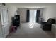 Expansive living room with neutral decor, lots of natural light, and exercise equipment at 306 Brier Summit Pl, Durham, NC 27703