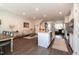 A comfortable living space connects kitchen, dining, and sitting areas, perfect for entertaining and relaxed living at 306 Brier Summit Pl, Durham, NC 27703