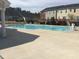 Sparkling community pool surrounded by modern residential buildings at 306 Brier Summit Pl, Durham, NC 27703