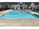 A large outdoor swimming pool offers residents a refreshing amenity surrounded by well-maintained townhome community at 306 Brier Summit Pl, Durham, NC 27703