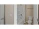 White tub and shower combination with a single sink vanity and neutral wall color at 326 Umstead St, Sanford, NC 27330